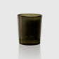 Dark green glass candle holder on a white background