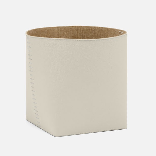 Beige rectangular storage basket with a brown interior on a white background
