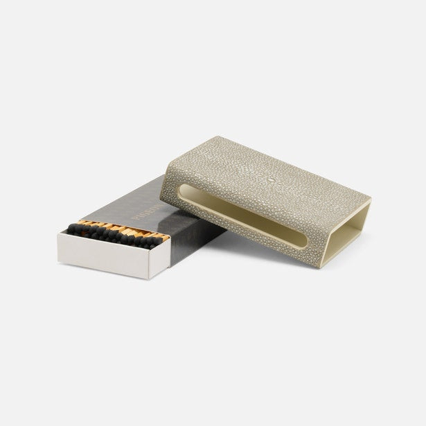 Matchbox with a textured cover on a white background