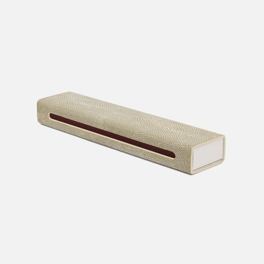 Rectangular beige shagreen object with a brown interior on a white background