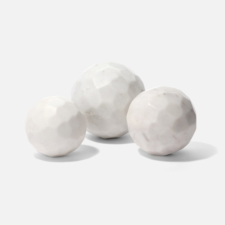 Three marble spheres on a white background