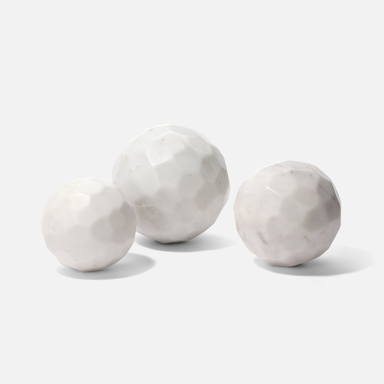 Three marble spheres on a white background