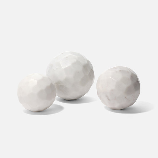 Three marble spheres on a white background