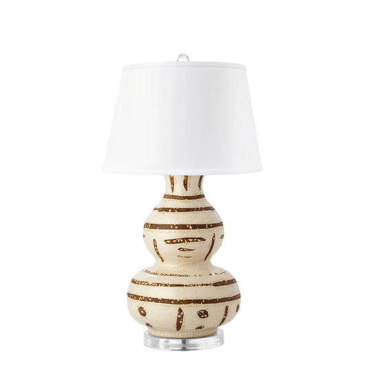 Decorative lamp with a white shade on a white background