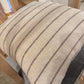 Textured cushion with striped pattern on a chair