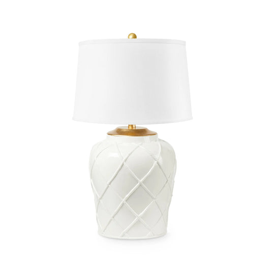 A table lamp with a glossy white ceramic base featuring a diamond lattice pattern, a white drum shade, and gold-finished metal accents at the neck and top finial, shown on a plain white background.