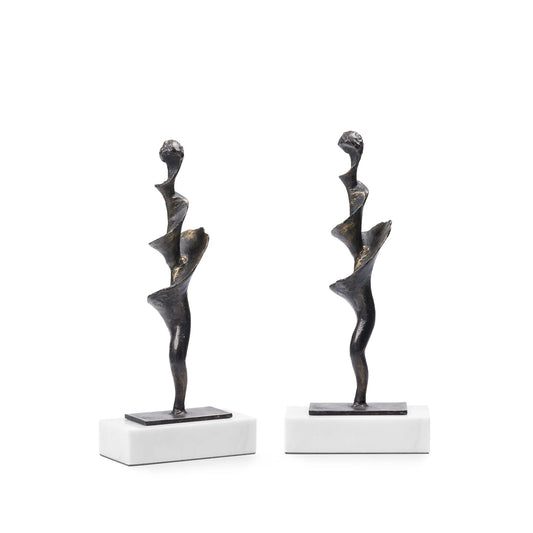 Spiral Statue Set of 2 in Bronze, featuring hand-cast iron sculptures inspired by organic conch shell forms, textured bronze finishes, and elegant white marble bases for sophisticated console table or bookshelf decor.
