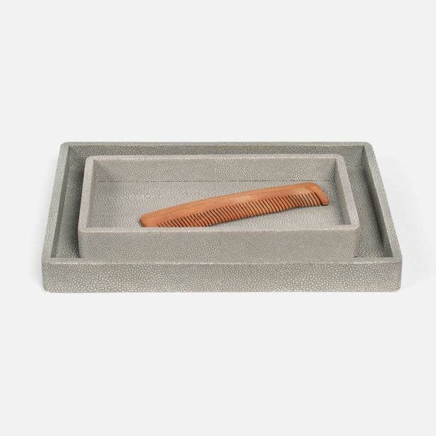 Brown comb in a gray textured box on a white background