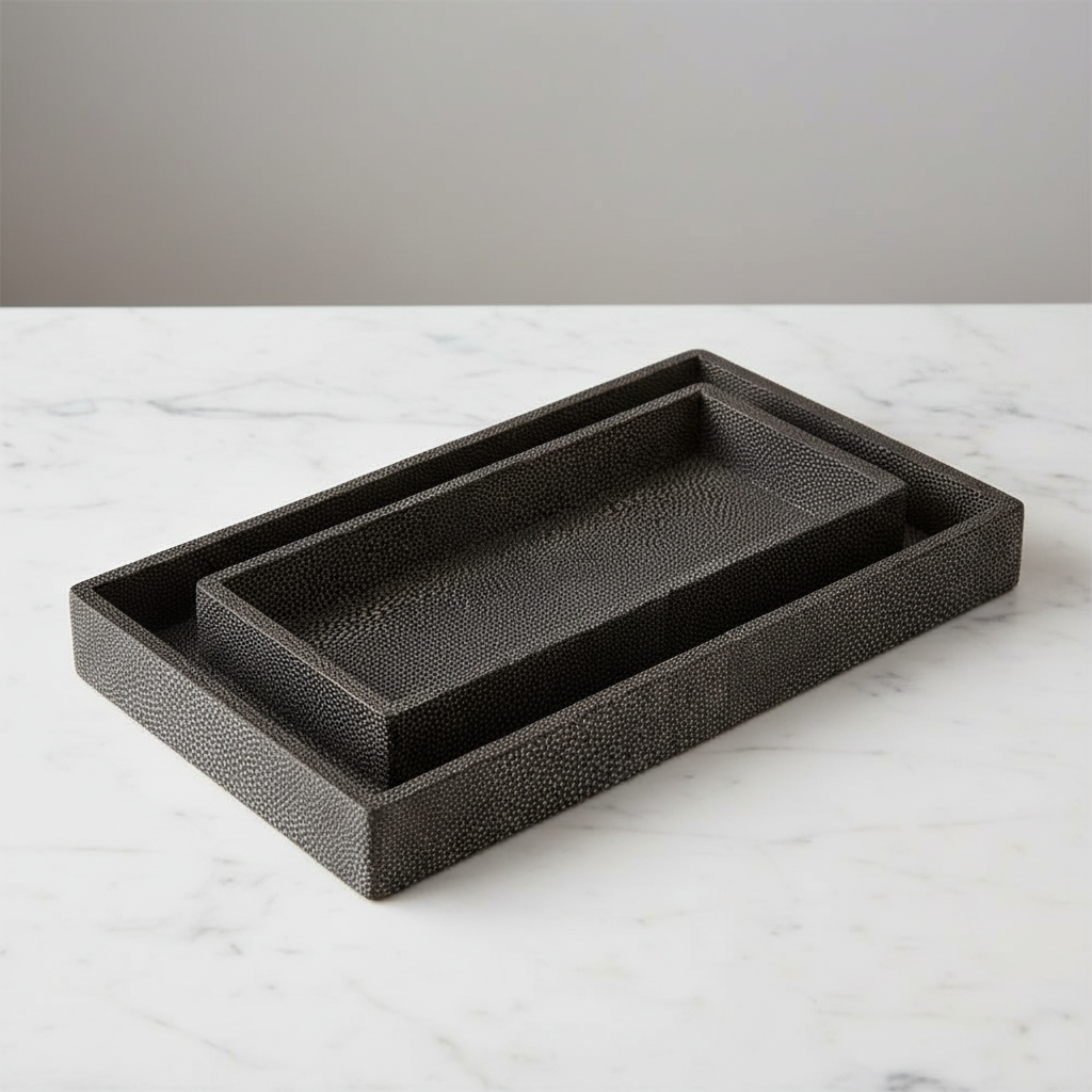 Black textured rectangular tray on a marble surface