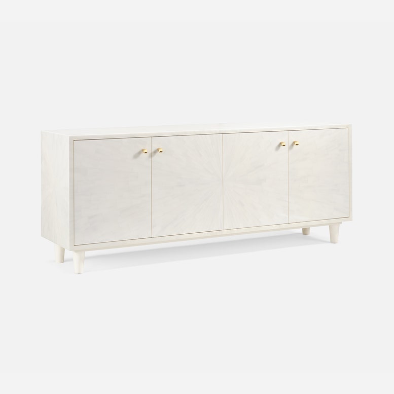 White sideboard with gold handles on a white background
