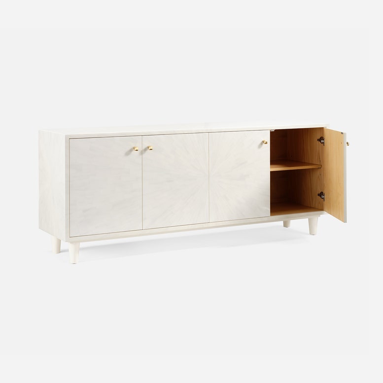 White sideboard with open cabinet on a white background