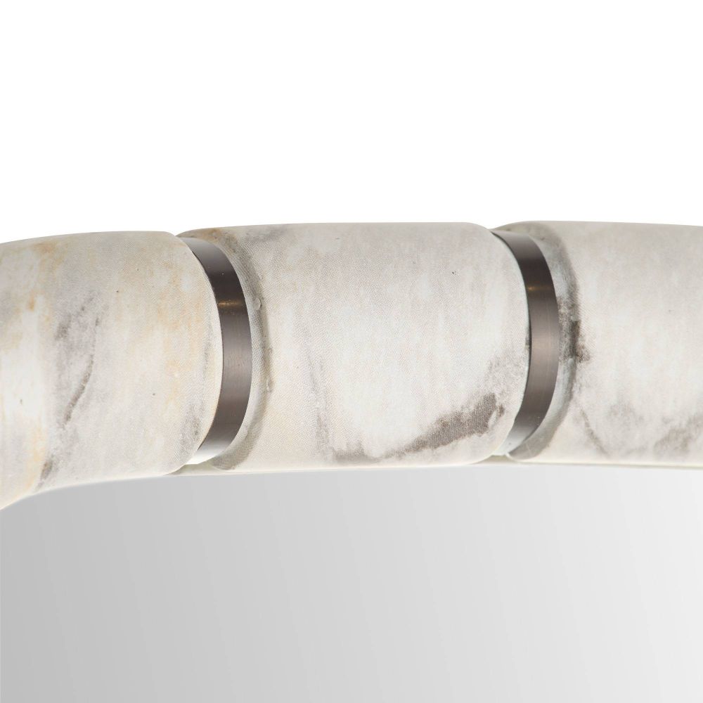 Close-up of a marble-patterned light fixture with metallic accents on a white background