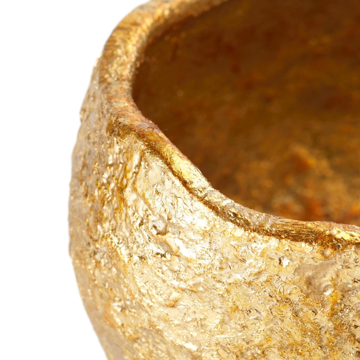 Close-up of a textured gold bowl on a white background