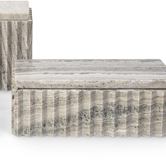 A modern rectangular box made of fluted gray stone with a matching stone top, shown on a clean white background.