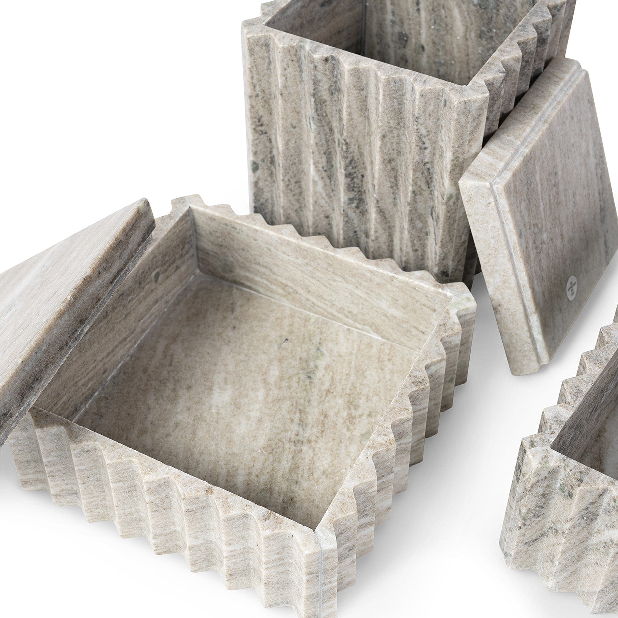 Set of stone-patterned square boxes on a white background
