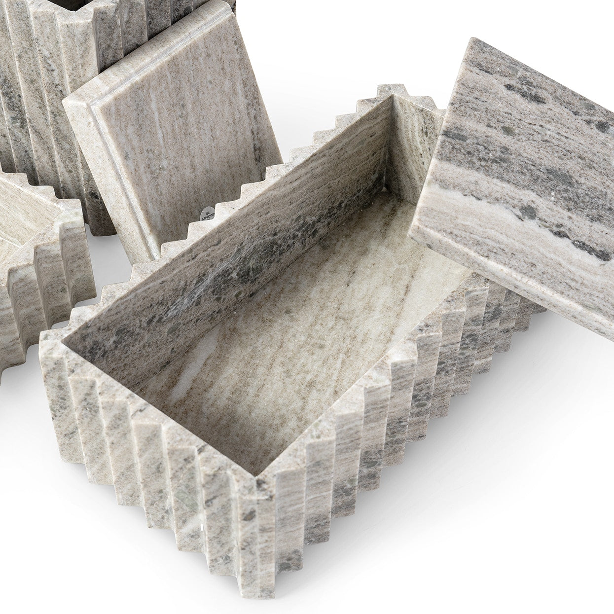 Marble-patterned concrete blocks on a white background