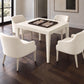 game table in the center of dining chairs