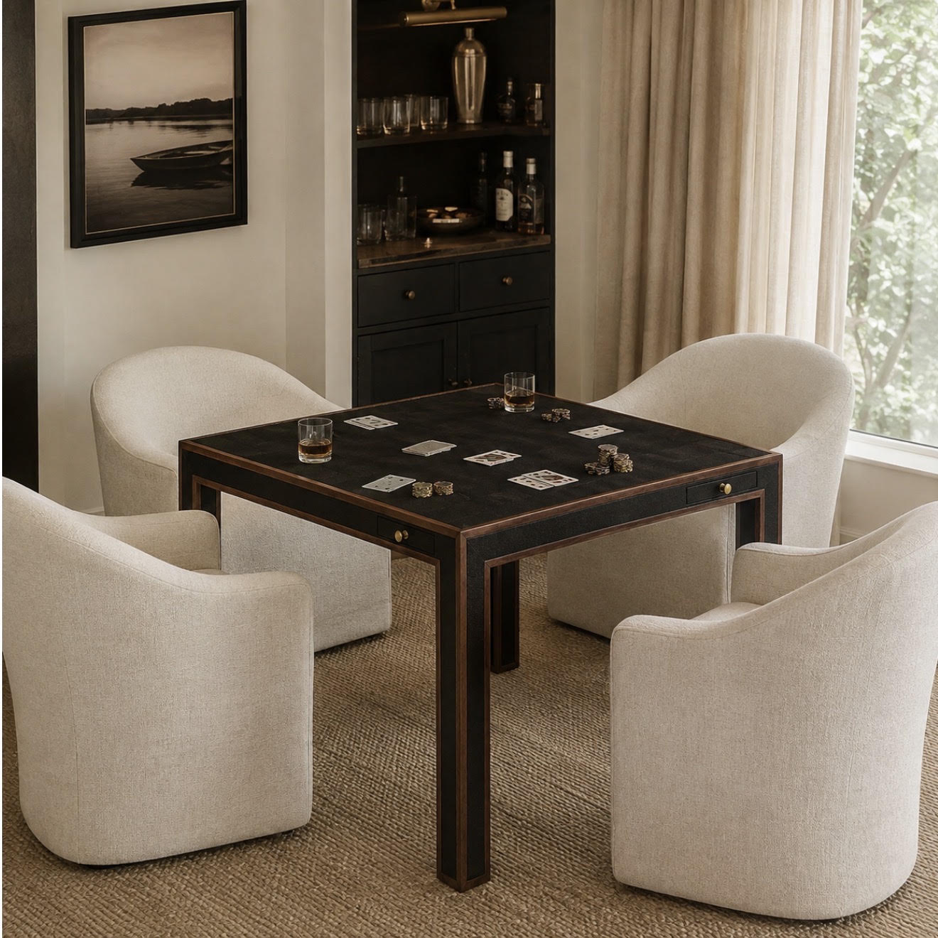 A dark wood square gaming table surrounded by four cream upholstered armchairs in a styled interior room with a window, curtains, and built-in shelving.