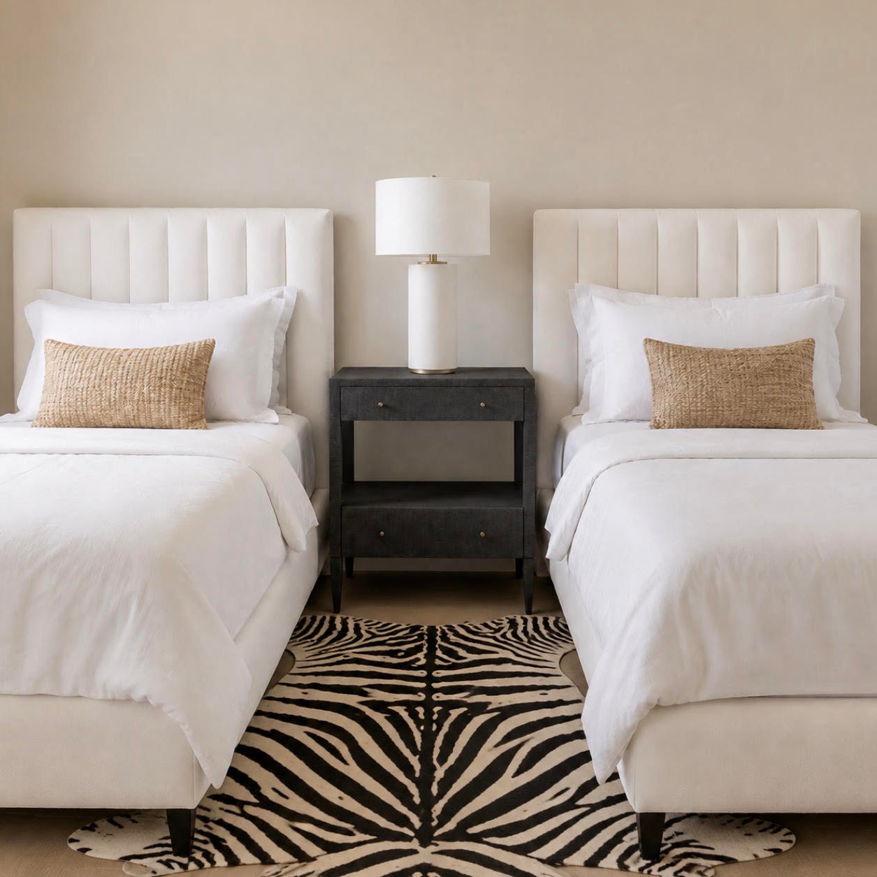 double black nightstand between two twin beds