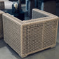 Close-up of a textured outdoor furniture piece with a blurred background