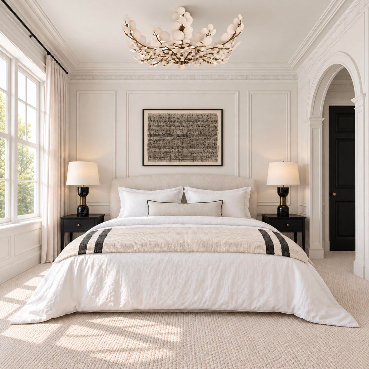A coconut shell flush mount displayed in an elegant neutral bedroom with white paneled walls, black nightstands, arched doorway, and natural light.