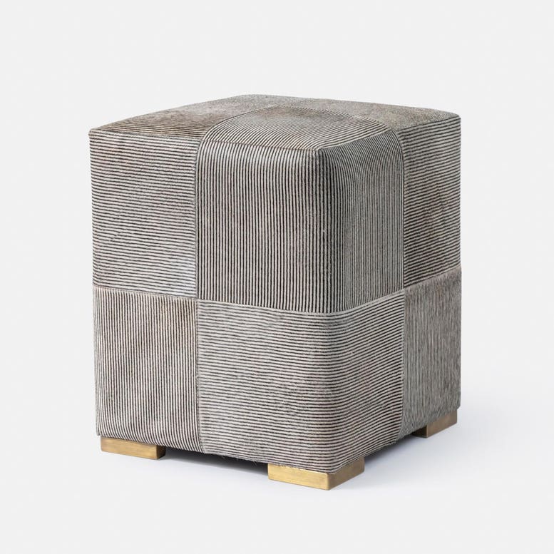 Square ottoman with a textured gray pattern on a white background