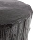 Close-up of a dark stone pedestal with a textured surface