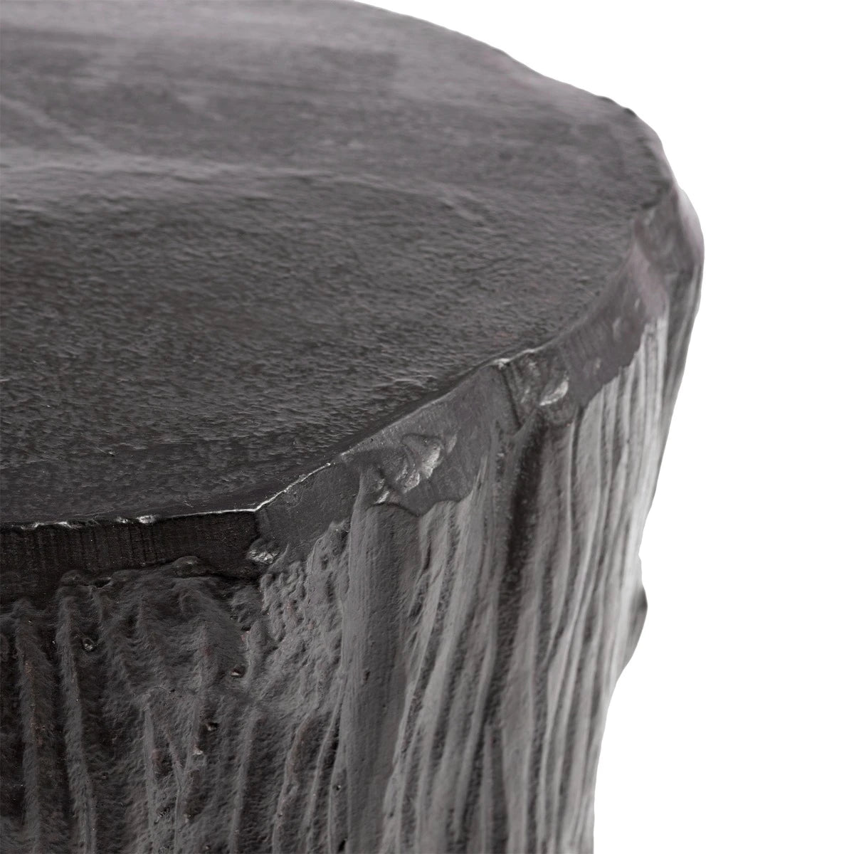 Close-up of a dark stone pedestal with a textured surface