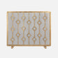 Decorative gold fireplace screen with geometric pattern on a white background