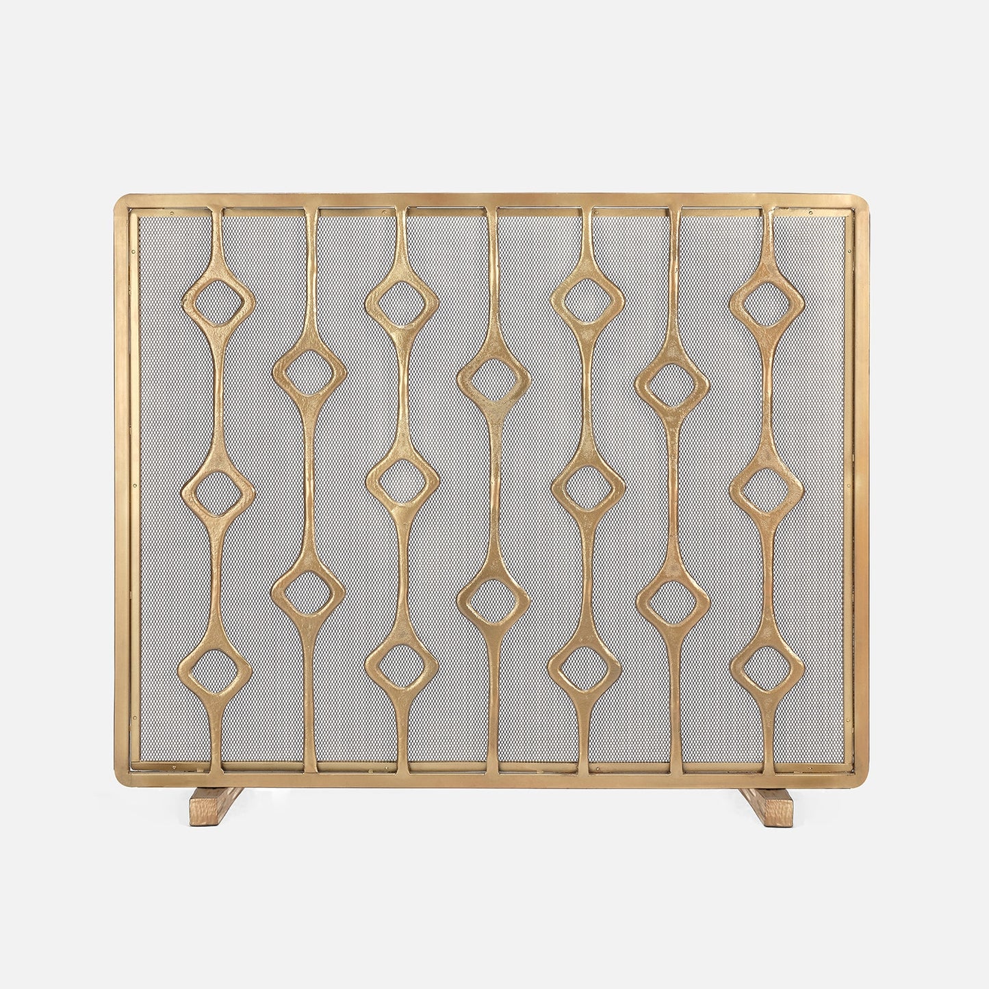 Decorative gold fireplace screen with geometric pattern on a white background