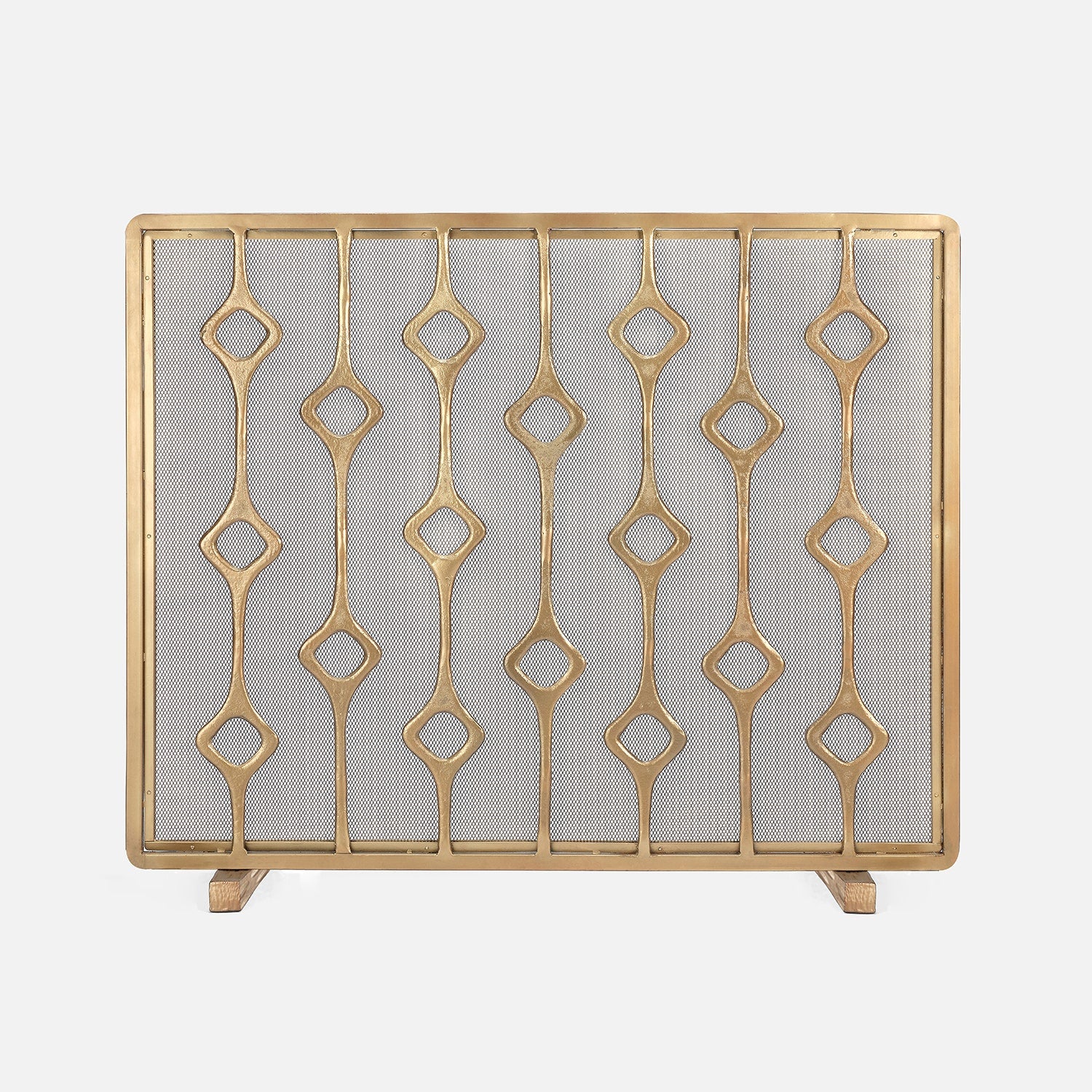 Decorative gold fireplace screen with geometric pattern on a white background
