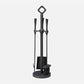 Black fireplace tool set with stand on a white background