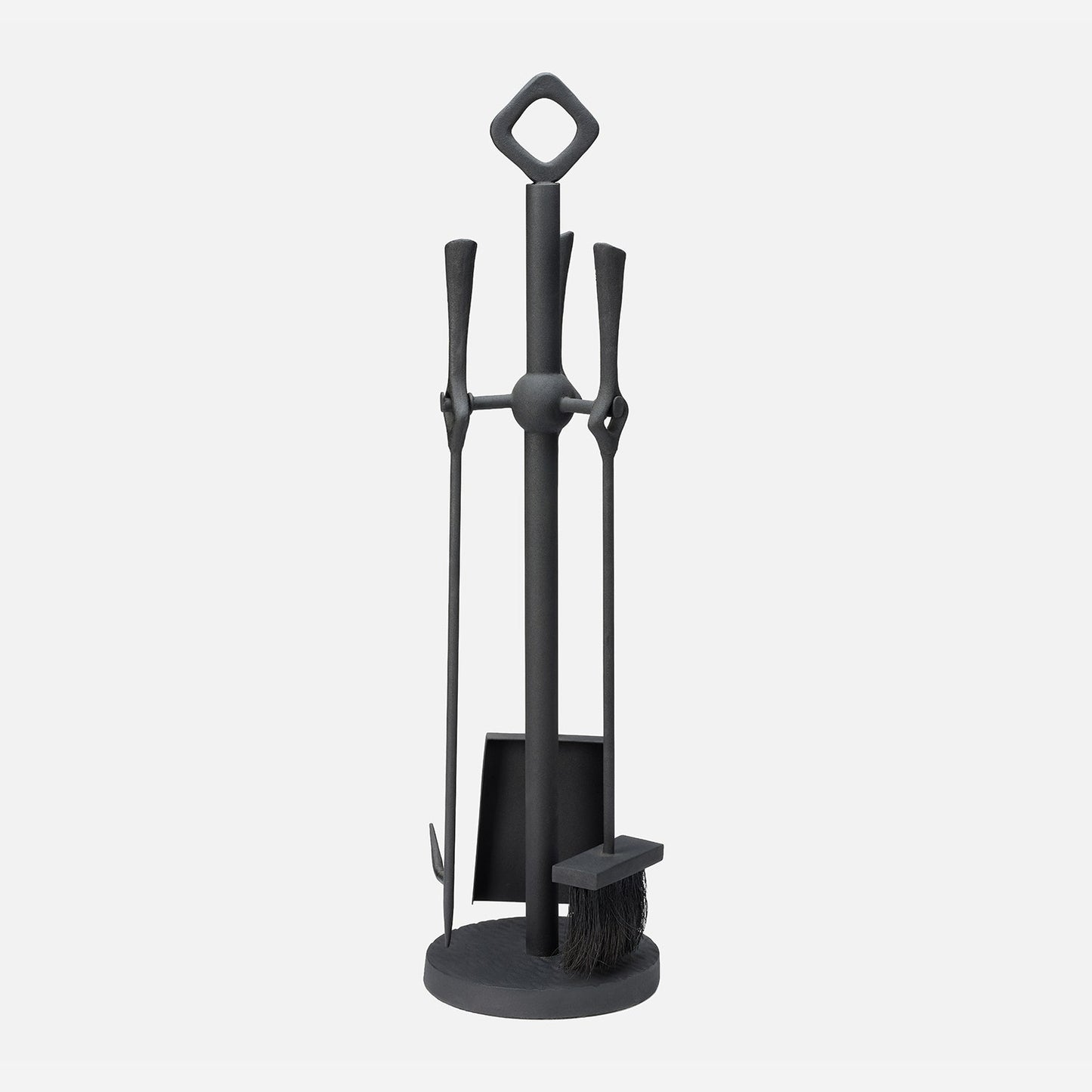 Black fireplace tool set with stand on a white background