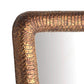Close-up of a textured bronze mirror frame on a white background
