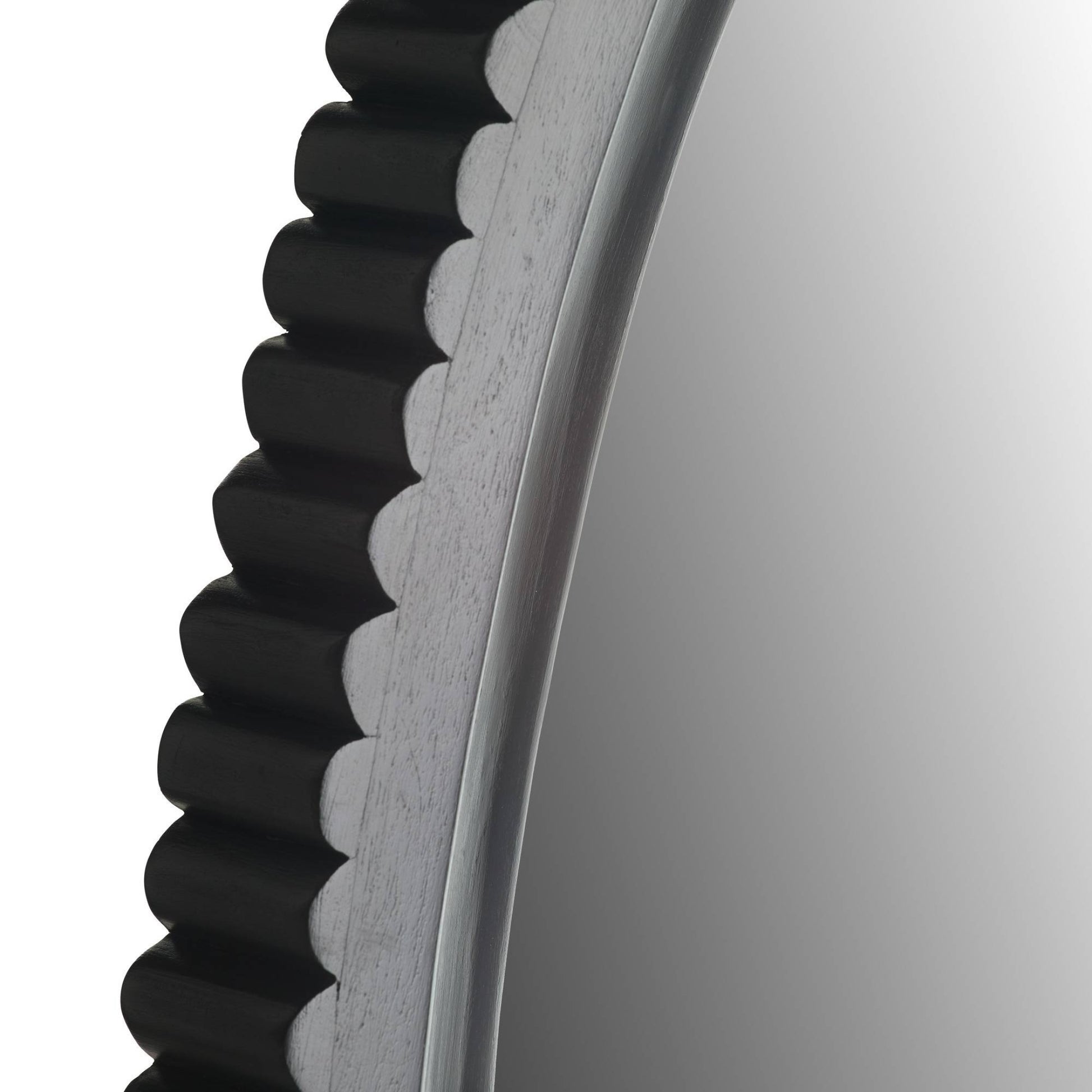 Close-up of a gear with teeth on a white background