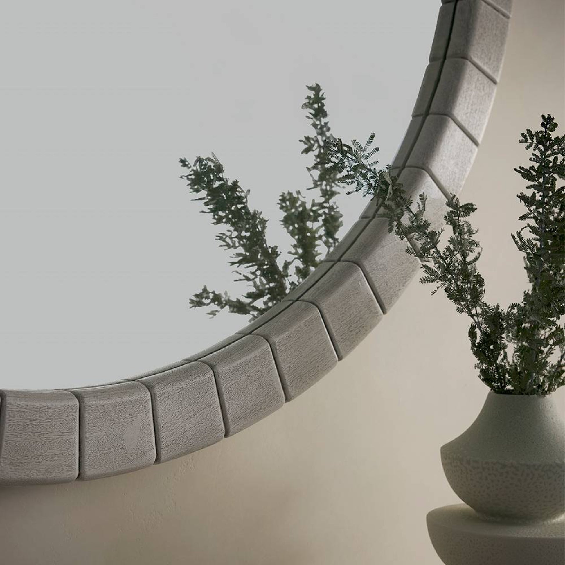 Decorative stone shelf with a plant on a neutral background