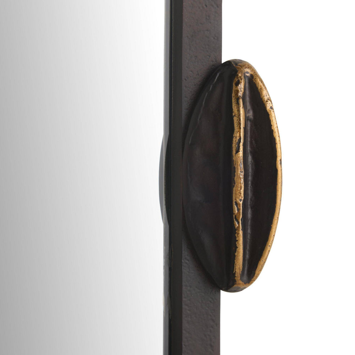 Decorative door handle on a metallic surface with a white background