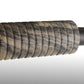 Close-up of a textured gun stock on a gray background