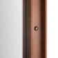 Close-up detail of a brown leather or faux-leather trim piece with visible stitching and a small round brass-toned rivet, set against a white background.