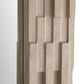 Close-up of a textured wooden panel with geometric pattern on a white background