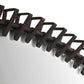 Close-up of a black spiral binding on a white background