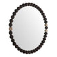 Round mirror with a dark wooden bead frame on a white background