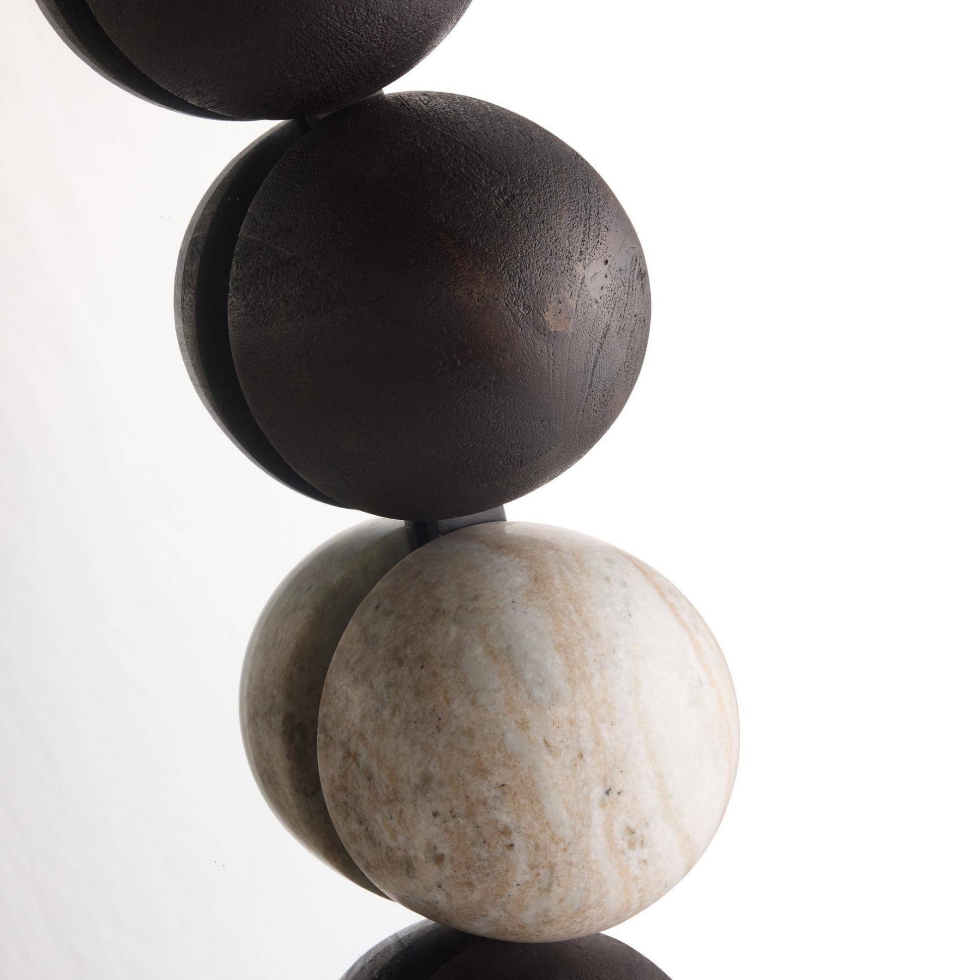 Close-up of stacked stone beads on a white background