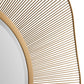 Close-up of a decorative wall mirror with a gold frame on a white background