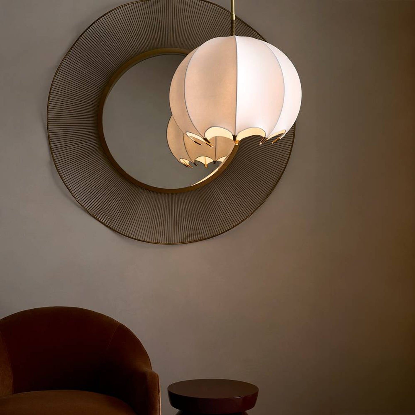 Modern pendant light fixture on a wall with a minimalistic design.