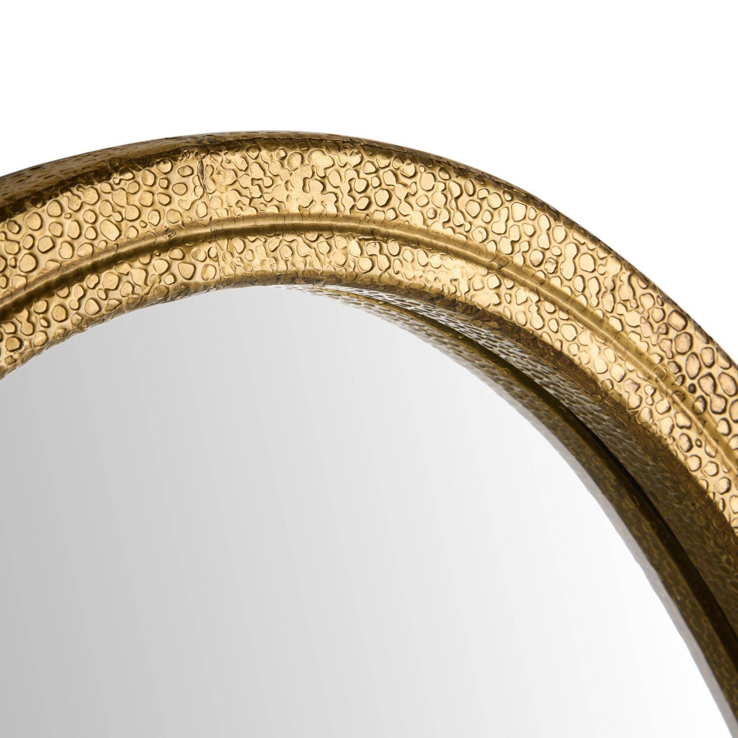 Close-up of a round mirror with a textured, hammered gold frame on a plain white background.