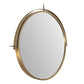 Round mirror with a gold frame on a white background