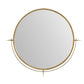 Round mirror with gold frame on a white background