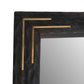 Decorative mirror with a dark frame and gold accents on a white background