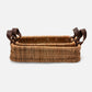 Wicker basket with leather handles on a white background